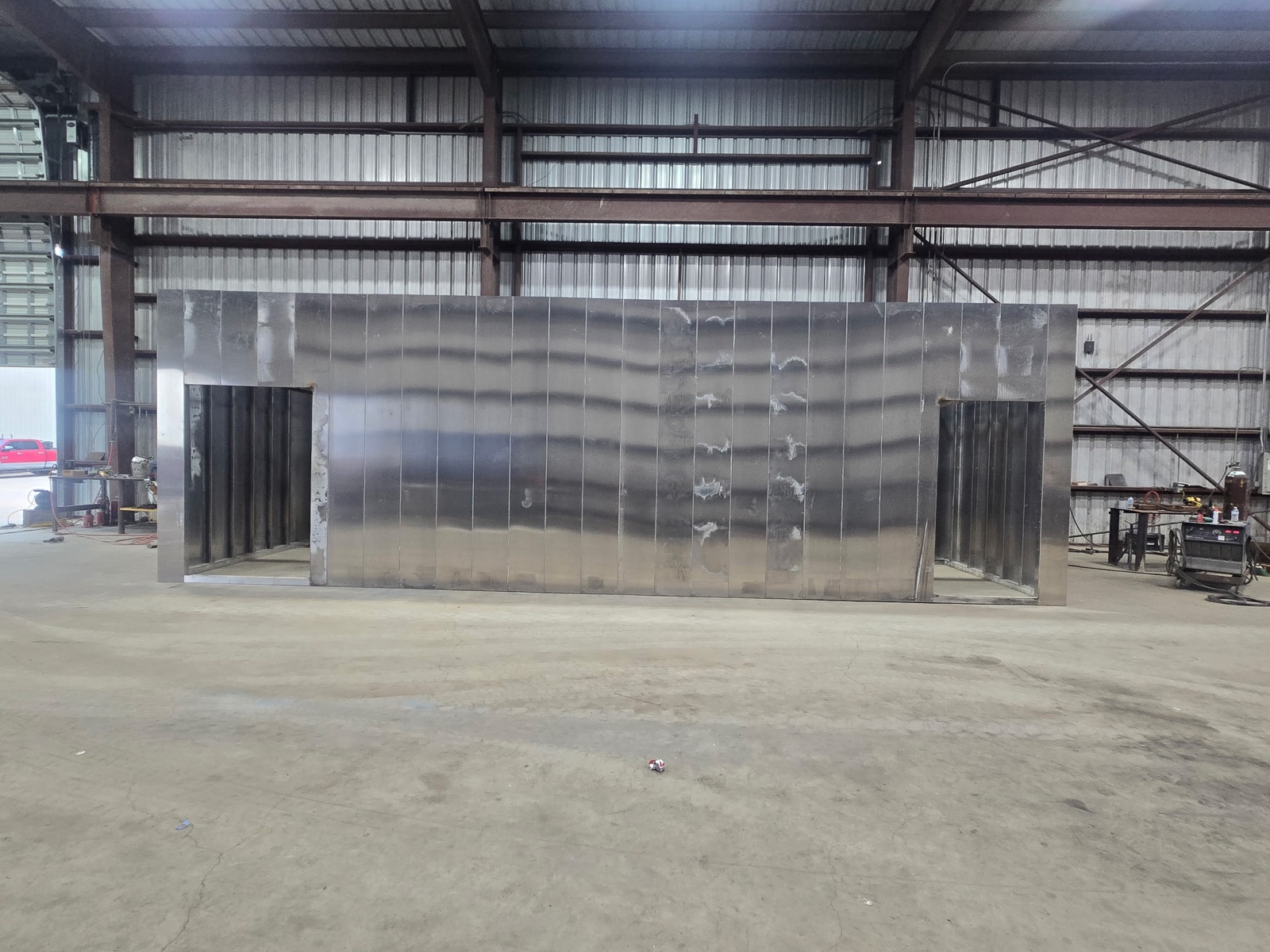 Steel modular enclosure under fabrication in a partner shop